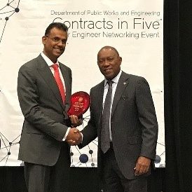 Kenall receiving an award